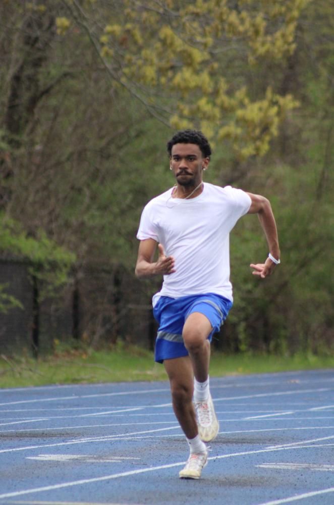 Caleb Carter dashes on the track. Photos by Brandy Muz