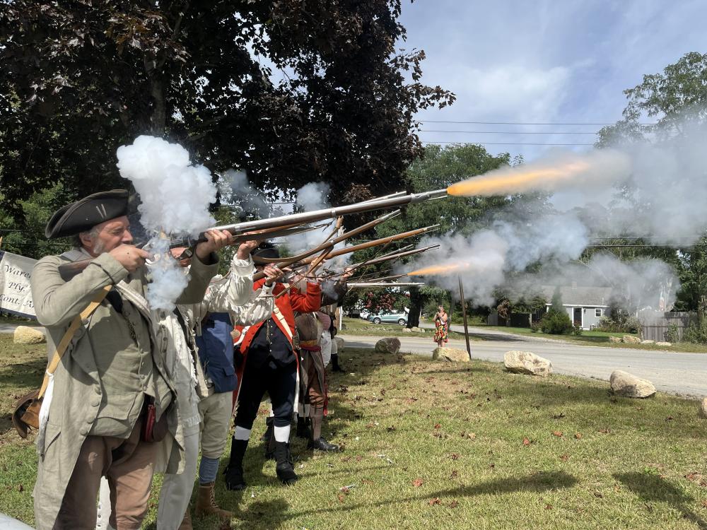 During the plaque ceremony, the Wareham Minutemen and Militia performed a three-musket volley salute by firing their arms.