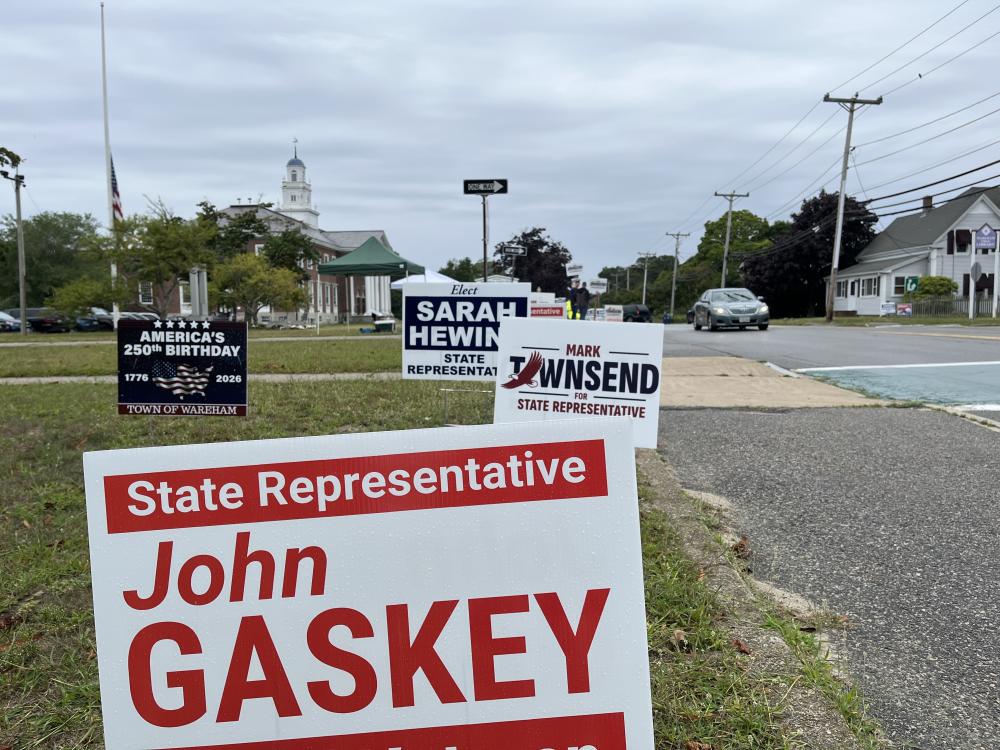 Signs for state representative candidates near Wareham Town Hall, one of the town's three polling locations. Photo by Christian Uva