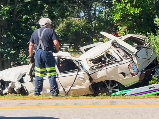 A crashed into a guardrail and rolled over into the median near mile marker 2.7 on Monday, July 13. Photo by David Curran
