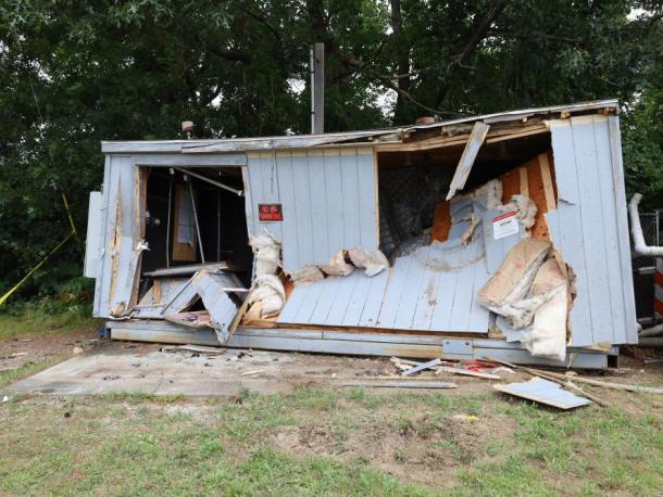 The front of a utility shed behind the 7-Eleven was caved in after a car slammed into it early morning on Monday, Aug. 3. Photos by Nick Mossman