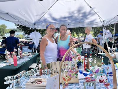 Joni Paulo and her daughter, Jasmine, at their stand. Photo by Christian Uva