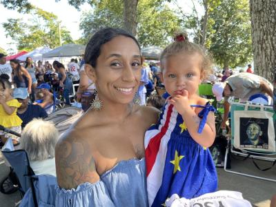Rochelle Cardoza and her daughter, London, 1, in a dress with a Cape Verde flag pattern. Photo by Christian Uva