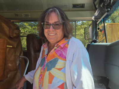 Bus driver Lisa Linhares waits outside of school to pick up schoolchildren after class. She said she is looking forward to "happy kids." Photo by Tanvi Kulkarni