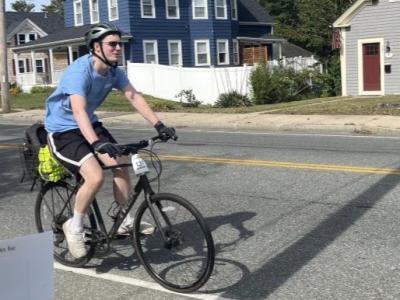 A rider cycles down Main Street. 