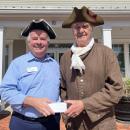 Howard Smith of the Minutemen and Militia accepts a grant from Glen Sherman of Cape Cod 5 to support the recognition day event. Photo by Tanvi Kulkarni