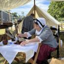 Cathy Potter mans the quill pen writing booth. She said most people that came to the booth had never written with a feather before. “They wrote the Declaration of Independence with a feather, so they get a history lesson with my featherwriting,” she said.