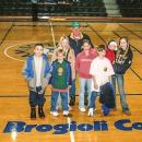 Brogioli with seven of his 17 grandchildren on the basketball court that was named in his honor.