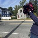 Volunteer Kimmy Schenter cheered cyclists on as they passed through Wareham. 