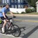 A rider cycles down Main Street. 