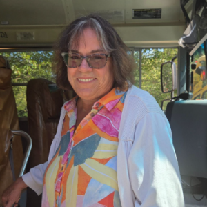 Bus driver Lisa Linhares waits outside of school to pick up schoolchildren after class. She said she is looking forward to "happy kids." Photo by Tanvi Kulkarni