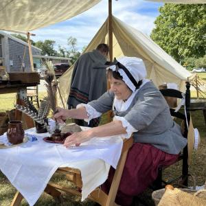 Cathy Potter mans the quill pen writing booth. She said most people that came to the booth had never written with a feather before. “They wrote the Declaration of Independence with a feather, so they get a history lesson with my featherwriting,” she said.