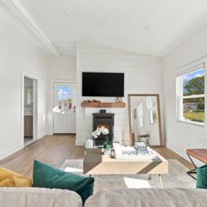 Pellet stove on a shiplap wall in the living room of 226 Sanford Road, Westport, MA