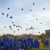 The graduates tossing their caps in the air. Photos by Kat Sheridan